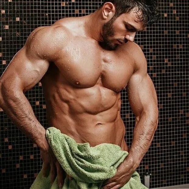 man taking a shower before doing penis enlargement exercises